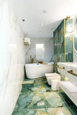 a bathroom with a tub and a sink at FIRST CLASS Studio Downtown Bliss Urban Gem in Dubai