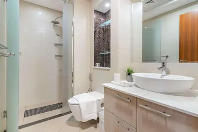 a bathroom with a sink and a toilet and a shower at Silkhaus Lavish 2BDR in Bay Square at Prime location in Dubai