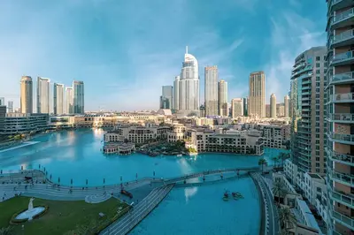a view of a city with a river and buildings at Panoramic Burj & Fountain Views 2BR in Dubai