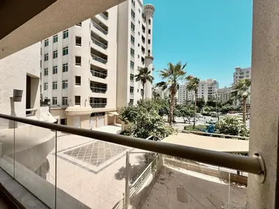 a balcony with a view of a building at Palm Paradise Walk to Beach in Dubai