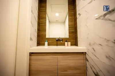 a bathroom with a sink and a mirror at Luxury Escapes Modern 1 Bed Apt City View Sol Bay Business Bay in Dubai