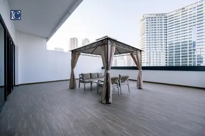 a gazebo on the roof of a building with chairs at Luxury Escapes Modern 1 Bed Apt City View Sol Bay Business Bay in Dubai