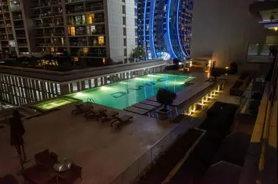 an overhead view of a pool in a building at night at Mejestic Studio in Dubai
