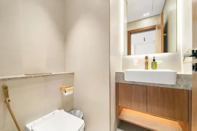 a bathroom with a sink and a toilet at VayK - Stylish Bright 1BR in JVC in Dubai