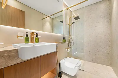 a bathroom with a sink and a shower at VayK - Stylish Bright 1BR in JVC in Dubai