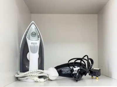 a room with a sewing machine on a counter at Stylish Studio Fast Wi-Fi 5 Min to Business Bay in Dubai