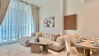 a living room with a couch and a table at Luxury Apartment in Binghatti Amber in Dubai