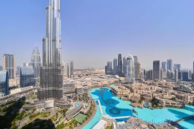an aerial view of a city with a river and skyscrapers at FAM Living Grande 2Bed with Panoramic Burj Khalifa Fountain View in Dubai