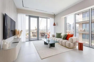 a living room with a couch and a table at Luxury 3BR & Maid - Canal View - Near Downtown in Dubai