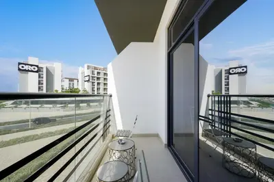 a balcony with chairs and a view of the city at Luxury Retreat in Arjan with Refined Living in Dubai
