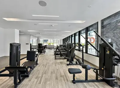 a gym with treadmills and cardio equipment in a building at AWS Holiday Homes - Relaxing Stylish Studio in Dubai