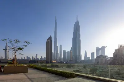 a view of a city skyline with tall buildings at Maison Privee - Urban & Elegant Stay Just Steps from Burj Khalifa in Dubai