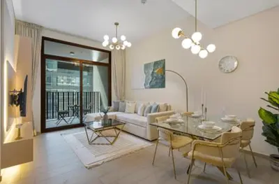 a living room with a table and a couch at Art-Inspired 1 Bedroom in Wilton Terraces in Dubai