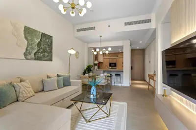 a living room with a couch and a table at Art-Inspired 1 Bedroom in Wilton Terraces in Dubai