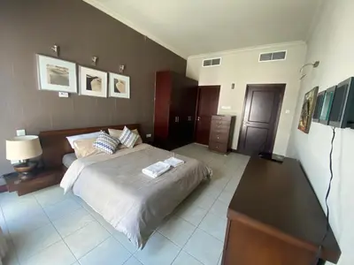 a bedroom with a bed with two towels on it at Stunning 1Bedroom Apartment 5 min walking distance Metro and JBR Beach in Dubai