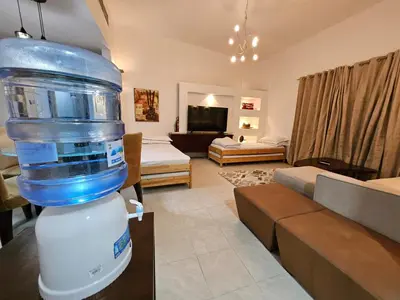 a living room with a large container on a table at Stunning 1Bedroom Apartment 5 min walking distance Metro and JBR Beach in Dubai