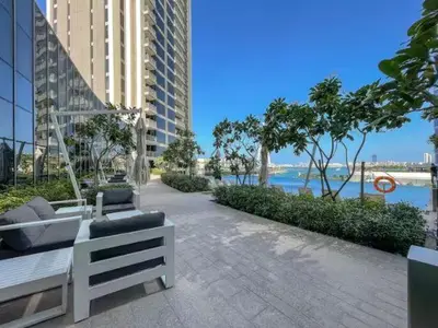 a patio with a bench and a view of the water at Vogue Marina 52-42 Towers near Ain Dubai and JBR Beach, Two Bedroom Apartment with Balcony Canal and Skyline views, Access to all Amenities in Dubai
