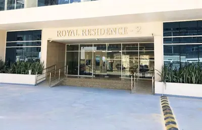 a facade of a building with a royal residence at Studio with Balcony Facing the Community, Located Near Golf Clubs and Cricket Stadium, Royale Residence 1 , Dubai Sports City by Deluxe Holiday Homes in Dubai