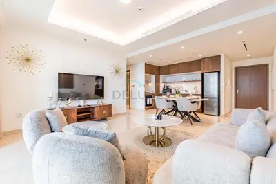 a living room with two couches and a kitchen at 1BR With Private Beach Access, Near Dubai Marina Walk, Next to Dubai Harbour Marina & Yacht Club, Palace Beach Residence, Dubai Marina by Deluxe Holiday Homes in Dubai