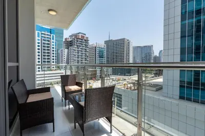 a balcony with chairs and a view of a city at Ahlan HH - Stylish Suite Heart of Business Bay Avanti Tower in Dubai