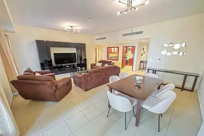 a living room with a couch and a table at Centrally Located Close to Beach in Dubai