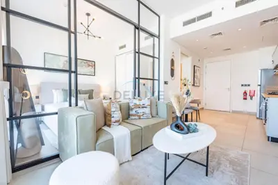 a living room with a couch and a table at Located Minutes walk to Dubai Hills Park, Near Dubai Hills Mall , Socio Tower 1, Dubai Hills by Deluxe Holiday Homes in Dubai