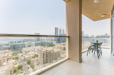 an apartment balcony with a view of a city at Golf Course And Canal Views, Mins to Dubai Marina And Dubai Mall, Golf Towers T1 - The Greens by Deluxe Holiday Homes in Dubai