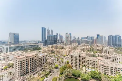 an aerial view of a city with tall buildings at Golf Course And Canal Views, Mins to Dubai Marina And Dubai Mall, Golf Towers T1 - The Greens by Deluxe Holiday Homes in Dubai