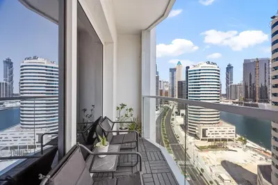 a balcony with benches and a view of the city at Art Studio - Cozy Loft, Fireplace, City Vistas in Dubai