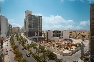 a view of a building under construction in a city at Luxury 1 BHK in Jumeirah Village Circle BydPie Concept 302 in Dubai