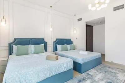 two beds in a room with blue bedskirts sidx sidx sidx sidx sidx at Luxury 4 BHK in Dubai Marina DEC 2102 in Dubai