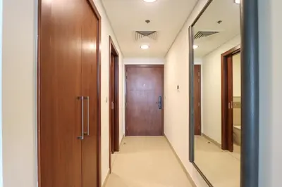 a corridor of a hospital with a door at Prime Located 2BR Near Burj Khalifa & Dubai Mall in Dubai