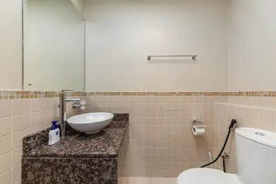 a bathroom with a sink and a toilet at Lovely 1BR Apartment Bahar 6 JBR in Dubai