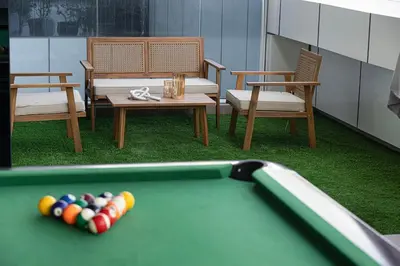 a room with a pool table and chairs at Lux 3BHK in Marina with Pool Table Opal 305 in Dubai