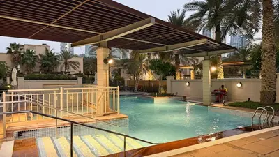 a large swimming pool with a canopy over it at Lux 2BHK w Marina view w Sky Light Mesk 2007 in Dubai