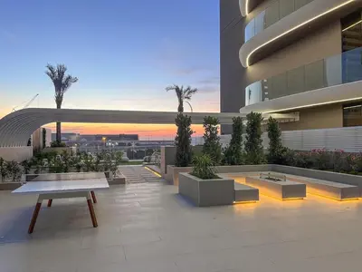 a patio with a bench and plants on a building at Luxury 1 BHK in Dubai Marina JVC 904 in Dubai