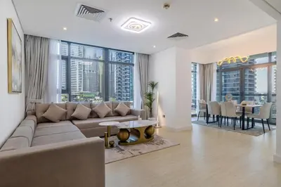 a living room with a couch and a table at Luxury 2BHK Stunning Skyline Lakeview in JLT 401 in Dubai