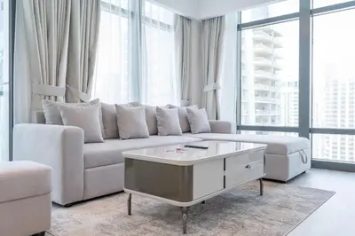 a living room with a couch and a coffee table at Luxury 2BHK in Jumeirah Late Towers JLT 2609 in Dubai