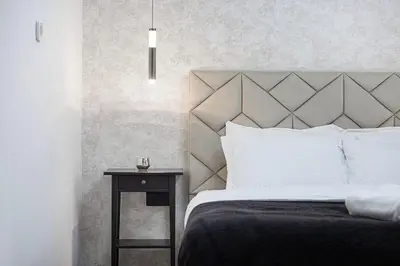 a bedroom with a bed and a side table at Lux 4BHK in JBR 5 Mins Walk to Beach Sadaf 8 102 in Dubai