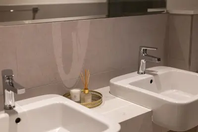a bathroom with a white sink and a mirror at Luxury Villa in Jebel Ali Village By dPie in Dubai