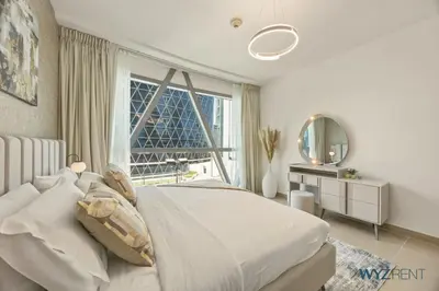 a bedroom with a bed and a large window at Plush Winter Stay 1BR Park Tower DIFC & Museum in Dubai