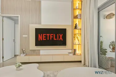 a living room with a netflix sign on a tv at Plush Winter Stay 1BR Park Tower DIFC & Museum in Dubai