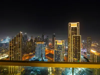 a view of a city skyline at night at 51st Floor Sea and Skyline Views LUXE 1BR in Dubai