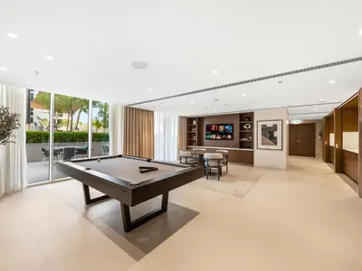 a living room with a pool table in it at Chic 1 Bedroom with Palm Views in Palace Beach Residence in Dubai