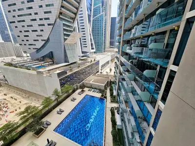 an overhead view of a building with a swimming pool at Merano Studio 920 in Dubai