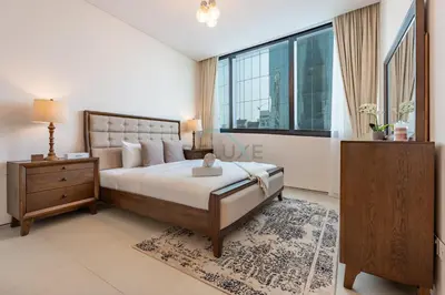 a bedroom with a large bed and a window at 3BR Overlooking Sea, Ain Dubai, and Bluewaters Island, Walking Distance to the Beach, The Address Residences, Jumeirah Beach Residence by Deluxe Holiday Homes in Dubai