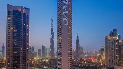 a tall building in the middle of a city at Panoramic Burj Khalifa View - Damac Distinction Downtown Dubai in Dubai