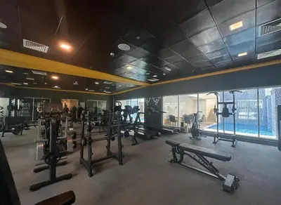 a gym with a lot of equipment in a room at Luxury 3BR Gem in the Heart of Dubai Marina in Dubai