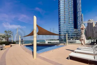 a pool in a city with a view of a building at Tourist Spot, Sea View - Next to Bluewaters & JBR in Dubai