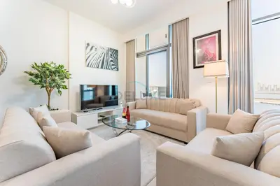 a living room with two couches and a tv at 1BR with Dubai Creek Views, Near Dubai Frame And Zabeel Park, Fawad Azizi Residence, Al Jadaf by Deluxe Holiday Homes in Dubai